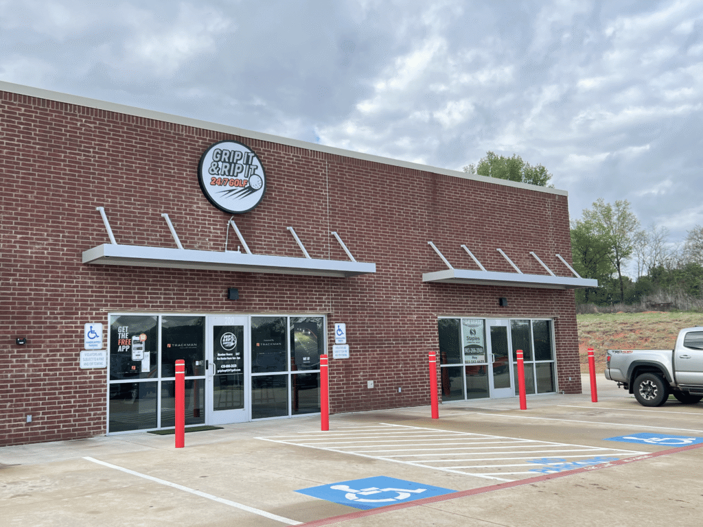 Daytime view of Grip It & Rip It Golf entrance with handicap parking in Palestine Texas